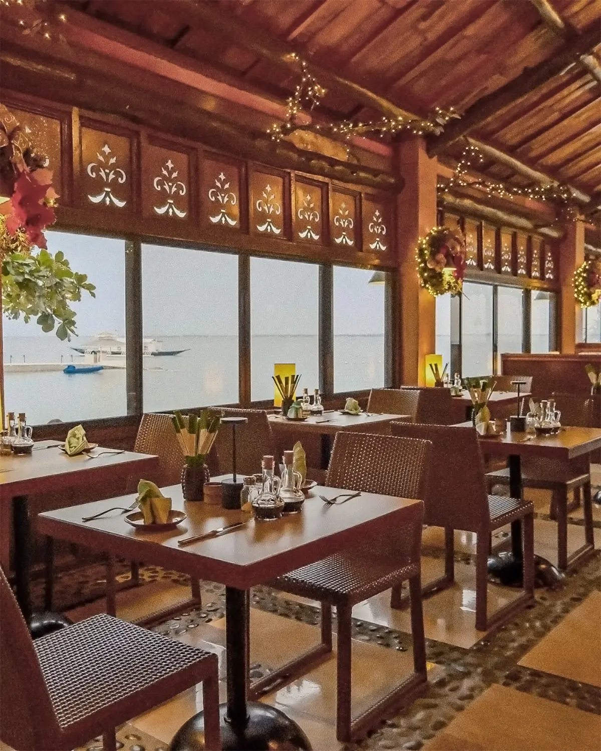 Fiji restaurant dining room with tables at the sea-view windows
