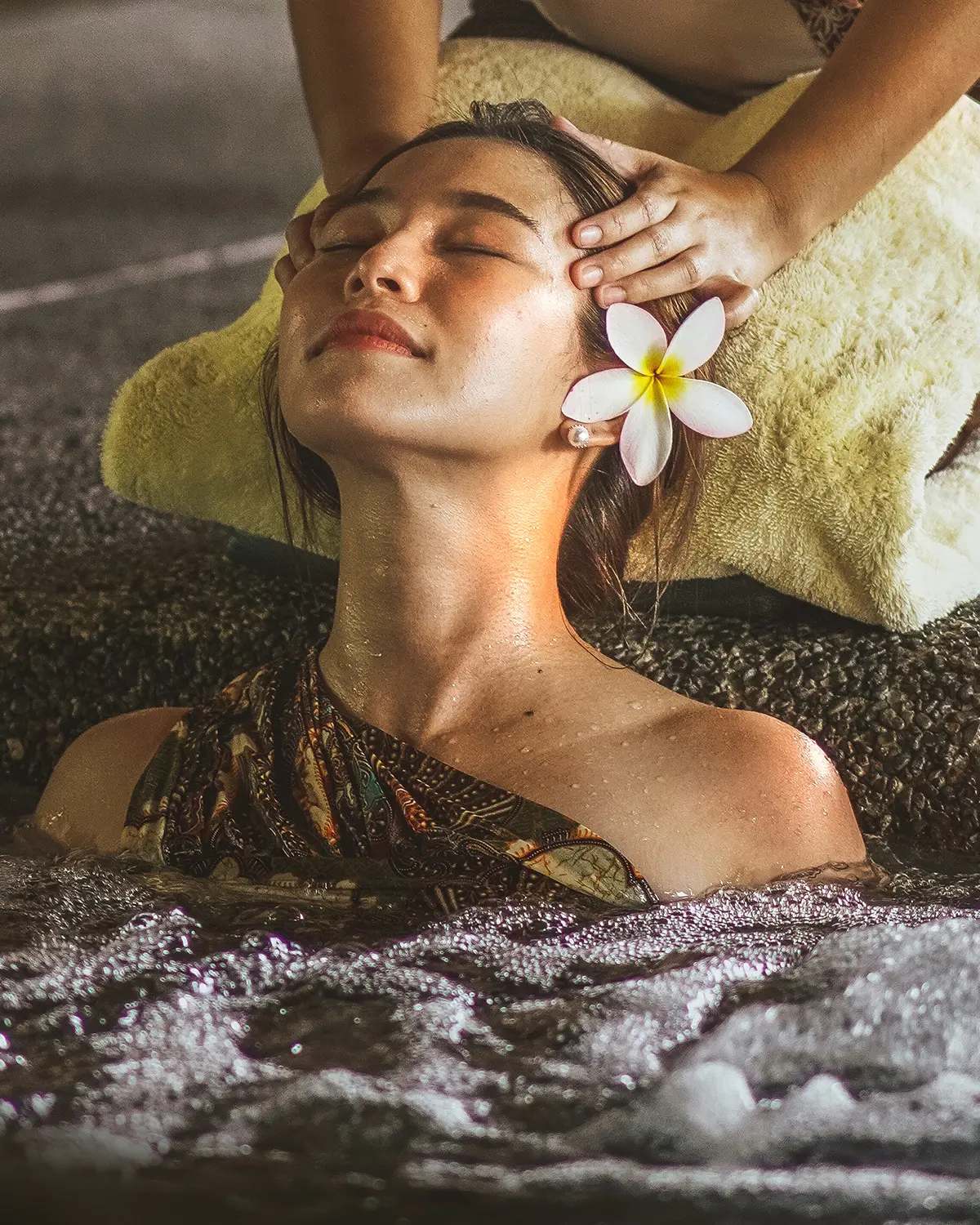 Head massage with frangipani